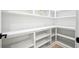 Well-organized pantry offers ample shelving for storing groceries and kitchen essentials at 4292 Sardis Church Rd, Buford, GA 30519