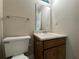 This bathroom features a white toilet and a marble sink at 8170 Canyon Forge Dr, Riverdale, GA 30274