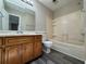 This bathroom features a shower-tub, white toilet, and marble sink at 8170 Canyon Forge Dr, Riverdale, GA 30274