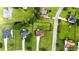 An aerial view of a home with a long driveway with mature landscape and neighborhood at 150 Crestworth Xing, Powder Springs, GA 30127