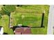 Aerial view of the lush backyard with a privacy fence and mature trees at 150 Crestworth Xing, Powder Springs, GA 30127