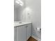 Clean bathroom with single sink vanity and a large mirror at 150 Crestworth Xing, Powder Springs, GA 30127