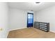 Clean bedroom featuring carpet, a modern dresser, and blue curtains at 150 Crestworth Xing, Powder Springs, GA 30127