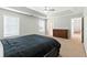 Large bedroom with tray ceiling, ceiling fan, and dresser at 150 Crestworth Xing, Powder Springs, GA 30127