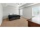 Spacious bedroom with tray ceiling, ceiling fan, and two windows at 150 Crestworth Xing, Powder Springs, GA 30127