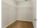 Spacious walk-in closet featuring ample shelving for organized storage at 150 Crestworth Xing, Powder Springs, GA 30127