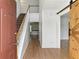 Inviting entryway with hardwood floors, an open staircase, and a modern barn door feature at 150 Crestworth Xing, Powder Springs, GA 30127