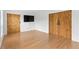 Open living room with wood-style barn doors and hardwood floors at 150 Crestworth Xing, Powder Springs, GA 30127