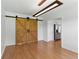 Cozy living space with barn doors and hardwood floors at 150 Crestworth Xing, Powder Springs, GA 30127