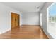 Spacious living space with barn doors, large windows, and hardwood floors at 150 Crestworth Xing, Powder Springs, GA 30127