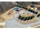 A view of the community amenities including a swimming pool, playground, and parking lot at 297 Aylesbury Blvd, Mcdonough, GA 30252