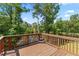 Spacious back deck overlooking the water and surrounding trees for outdoor enjoyment at 297 Aylesbury Blvd, Mcdonough, GA 30252