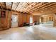 Large, unfinished basement providing ample storage and expansion possibilities at 297 Aylesbury Blvd, Mcdonough, GA 30252