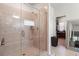 Tiled bathroom shower featuring glass door and neutral color palette at 297 Aylesbury Blvd, Mcdonough, GA 30252