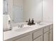Bathroom features a double vanity with modern fixtures at 297 Aylesbury Blvd, Mcdonough, GA 30252