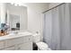 Well-maintained bathroom with toilet, sink, and shower combination at 297 Aylesbury Blvd, Mcdonough, GA 30252
