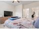 Relaxing bedroom featuring neutral walls and easy access to an adjacent bathroom at 297 Aylesbury Blvd, Mcdonough, GA 30252