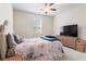 Comfortable bedroom with natural light, ceiling fan and neutral decor at 297 Aylesbury Blvd, Mcdonough, GA 30252