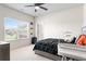 Well-lit bedroom with large window and neutral color scheme at 297 Aylesbury Blvd, Mcdonough, GA 30252