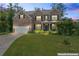 Charming two-story brick home with well-manicured lawn and attached two-car garage at 297 Aylesbury Blvd, Mcdonough, GA 30252
