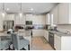 Well-equipped kitchen features white cabinets, granite countertops, and stainless steel appliances at 297 Aylesbury Blvd, Mcdonough, GA 30252