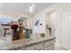 Granite kitchen island with decorative vases, flowers, and gold accents on the countertop at 297 Aylesbury Blvd, Mcdonough, GA 30252