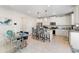 Modern kitchen with white cabinets, stainless steel appliances, granite countertops, and an island with seating at 297 Aylesbury Blvd, Mcdonough, GA 30252