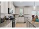 Spacious kitchen with stainless steel appliances, granite countertops, and ample storage at 297 Aylesbury Blvd, Mcdonough, GA 30252