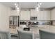 Beautiful kitchen with white cabinets, stainless steel appliances, and granite countertops at 297 Aylesbury Blvd, Mcdonough, GA 30252
