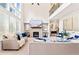 Spacious living room with fireplace, high ceilings, abundant natural light, and stylish modern decor at 297 Aylesbury Blvd, Mcdonough, GA 30252