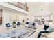 Bright living room showcasing high ceilings, modern furnishings, and seamless access to the kitchen at 297 Aylesbury Blvd, Mcdonough, GA 30252