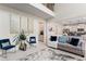 Bright living room showcasing high ceilings, modern furnishings, seamless access to the kitchen and second floor at 297 Aylesbury Blvd, Mcdonough, GA 30252