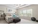 Main bedroom with tray ceiling, chandelier fan and large windows providing ample sunlight at 297 Aylesbury Blvd, Mcdonough, GA 30252