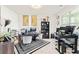 Bright office space with dual monitors, white chairs, and a decorative black and white rug at 297 Aylesbury Blvd, Mcdonough, GA 30252