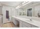 Bright bathroom with double sinks, large mirror and tile floor offers ample space at 3707 Vineyards Lake Nw Cir # 22, Kennesaw, GA 30144