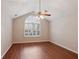 Bedroom features vaulted ceiling, a fan, laminated floor and a window with shutters at 3707 Vineyards Lake Nw Cir # 22, Kennesaw, GA 30144
