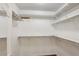 Walk-in closet with shelves for storing items at 3707 Vineyards Lake Nw Cir # 22, Kennesaw, GA 30144
