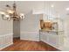 Dining space seamlessly connecting to a modern kitchen with stainless steel appliances and ample countertop space at 3707 Vineyards Lake Nw Cir # 22, Kennesaw, GA 30144