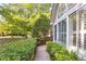 Street side view of well-maintained landscaping, large windows, and mature trees at 3707 Vineyards Lake Nw Cir # 22, Kennesaw, GA 30144