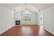 Bright living room with vaulted ceiling, fireplace, and large windows offering an airy and open feel at 3707 Vineyards Lake Nw Cir # 22, Kennesaw, GA 30144