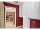 Pantry with red walls, white cabinets, and stainless steel oven viewed from doorway at 3707 Vineyards Lake Nw Cir # 22, Kennesaw, GA 30144