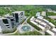 Stunning aerial view of property featuring modern architecture, lush greenery, and a beautiful fountain in the center at 1598 Aldworth Se Pl, Marietta, GA 30339