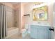 Stylish bathroom features a shower/tub combination, vanity and accent mirror at 1598 Aldworth Se Pl, Marietta, GA 30339