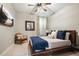 Bedroom with a rustic bed frame, accent chair and natural light at 1598 Aldworth Se Pl, Marietta, GA 30339