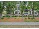 Inviting brick townhome exterior with wrought iron accents and mature trees in a desirable neighborhood at 1598 Aldworth Se Pl, Marietta, GA 30339
