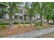 Beautiful townhome exteriors, showcasing brick and siding, with landscaped front yards and walkways at 1598 Aldworth Se Pl, Marietta, GA 30339
