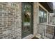 Charming front door with decorative wreath and brick facade at 1598 at 1598 Aldworth Se Pl, Marietta, GA 30339