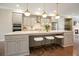 Stylish kitchen island with bar seating, pendant lights, and stainless steel appliances at 1598 Aldworth Se Pl, Marietta, GA 30339