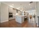 Modern kitchen featuring sleek gray cabinets, quartz countertops, stainless steel appliances, and pendant lighting at 1598 Aldworth Se Pl, Marietta, GA 30339