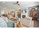 Open-concept living room features a fireplace, hardwood floors, and seamless access to the kitchen at 1598 Aldworth Se Pl, Marietta, GA 30339
